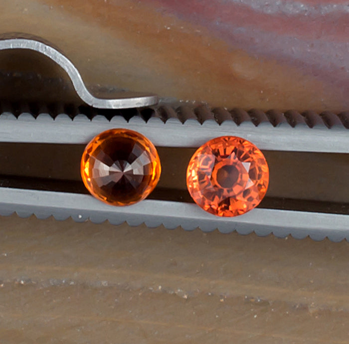 0.93twt Orange Sapphire Colored Gemstone Pair Top and Bottom View Natural Background 
