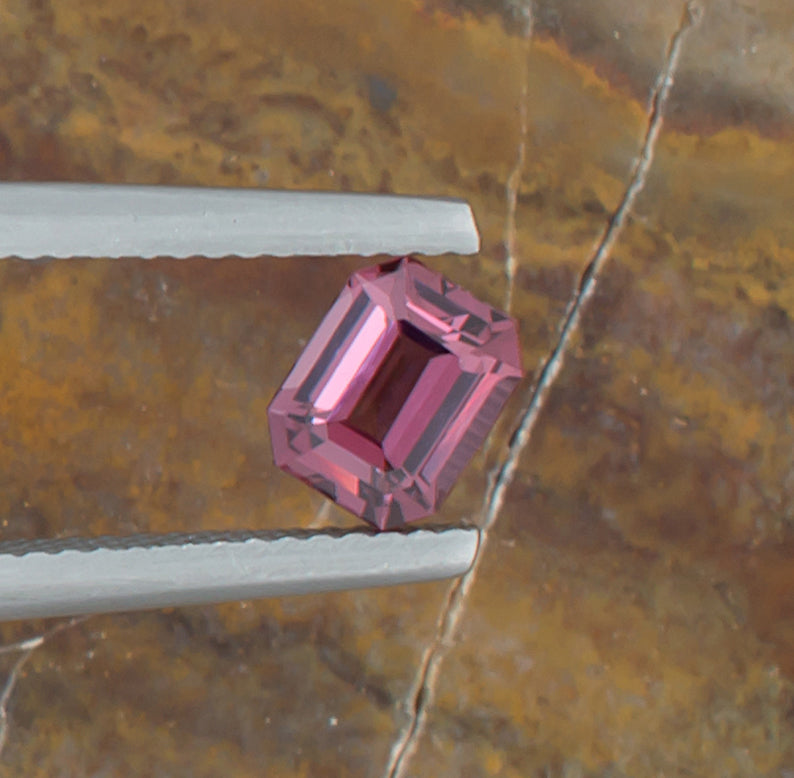 0.95ct Spinel Colored Gemstone Top View Angle Natural Background 