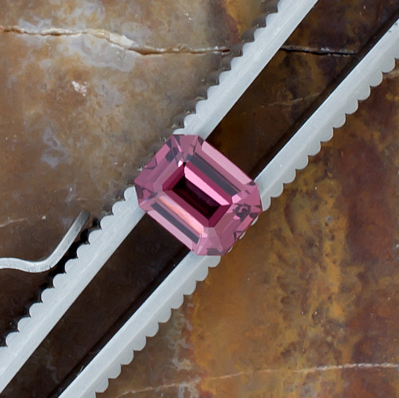 0.95ct Spinel Colored Gemstone Top View Tweezers Natural Background