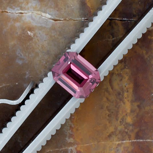 0.95ct Spinel Colored Gemstone Top View Tweezers Natural Background