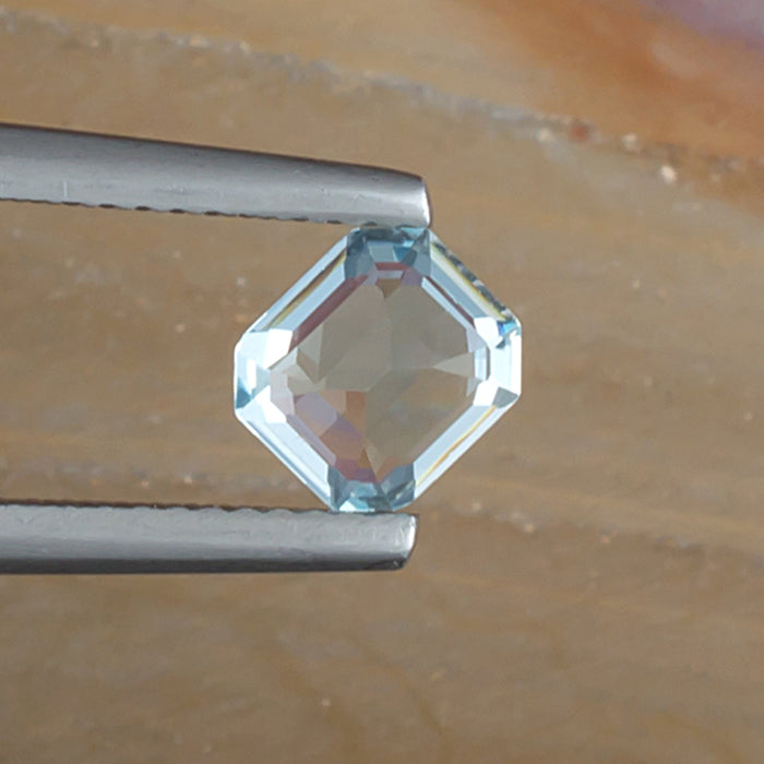 0.97ct Aquamarine Colored Gemstone Bottom View Natural Background 
