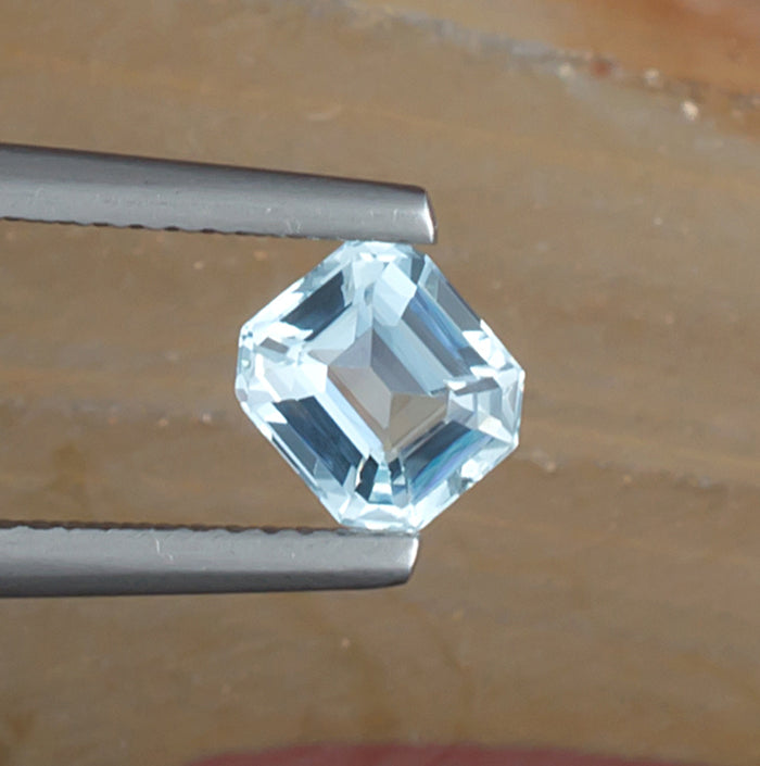 0.97ct Aquamarine Colored Gemstone Top View Natural Background 
