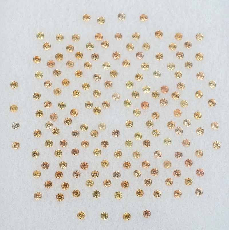 1.00mm Orange Sapphire Colored Gemstone Melee Parcel Top View White Background

