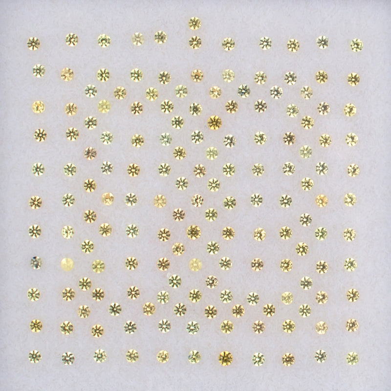 1.00mm Yellow Sapphire Colored Gemstone Melee Parcel Top View White Background
