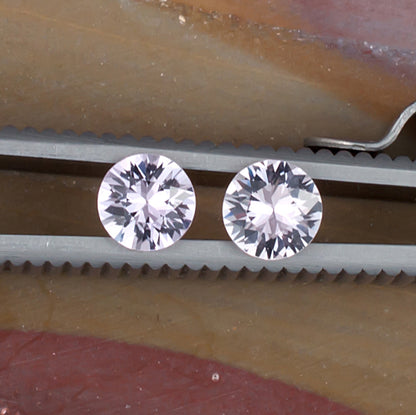 1.01twt Pink Sapphire Colored Gemstone Pair Top View Natural Background
