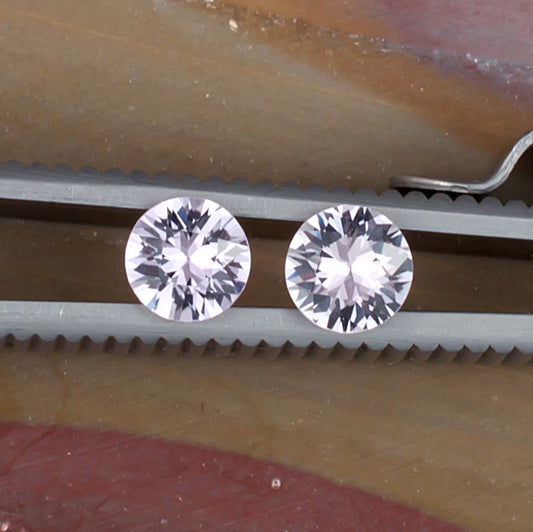 1.01twt Pink Sapphire Colored Gemstone Pair Top View Natural Background
