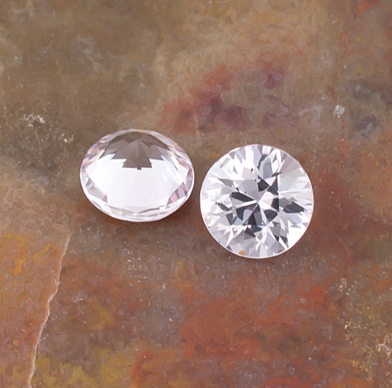 1.03twt Pink Sapphire Colored Gemstone Pair Crown Pavilion View Natural Background
