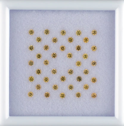 1.07twt Yellow Sapphire Colored Gemstone Melee Parcel Top View White Background
