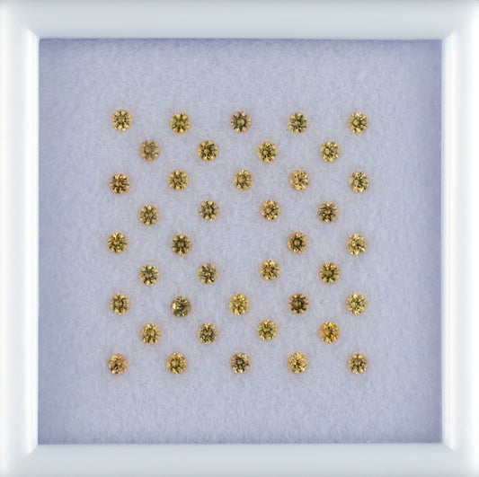 1.07twt Yellow Sapphire Colored Gemstone Melee Parcel Top View White Background
