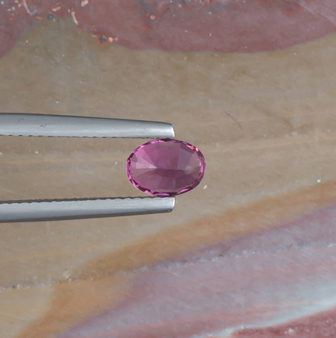 1.11ct Malaya Garnet Colored Gemstone Bottom View Natural Background 
