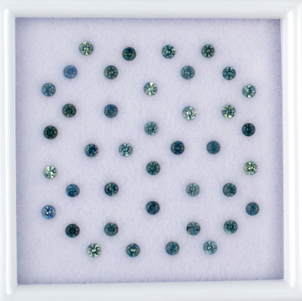 1.13twt Blue Sapphire Colored Gemstone Melee Parcel Top View White Background
