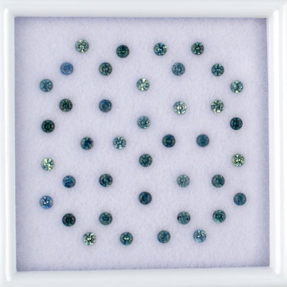 1.13twt Blue Sapphire Colored Gemstone Melee Parcel Top View White Background
