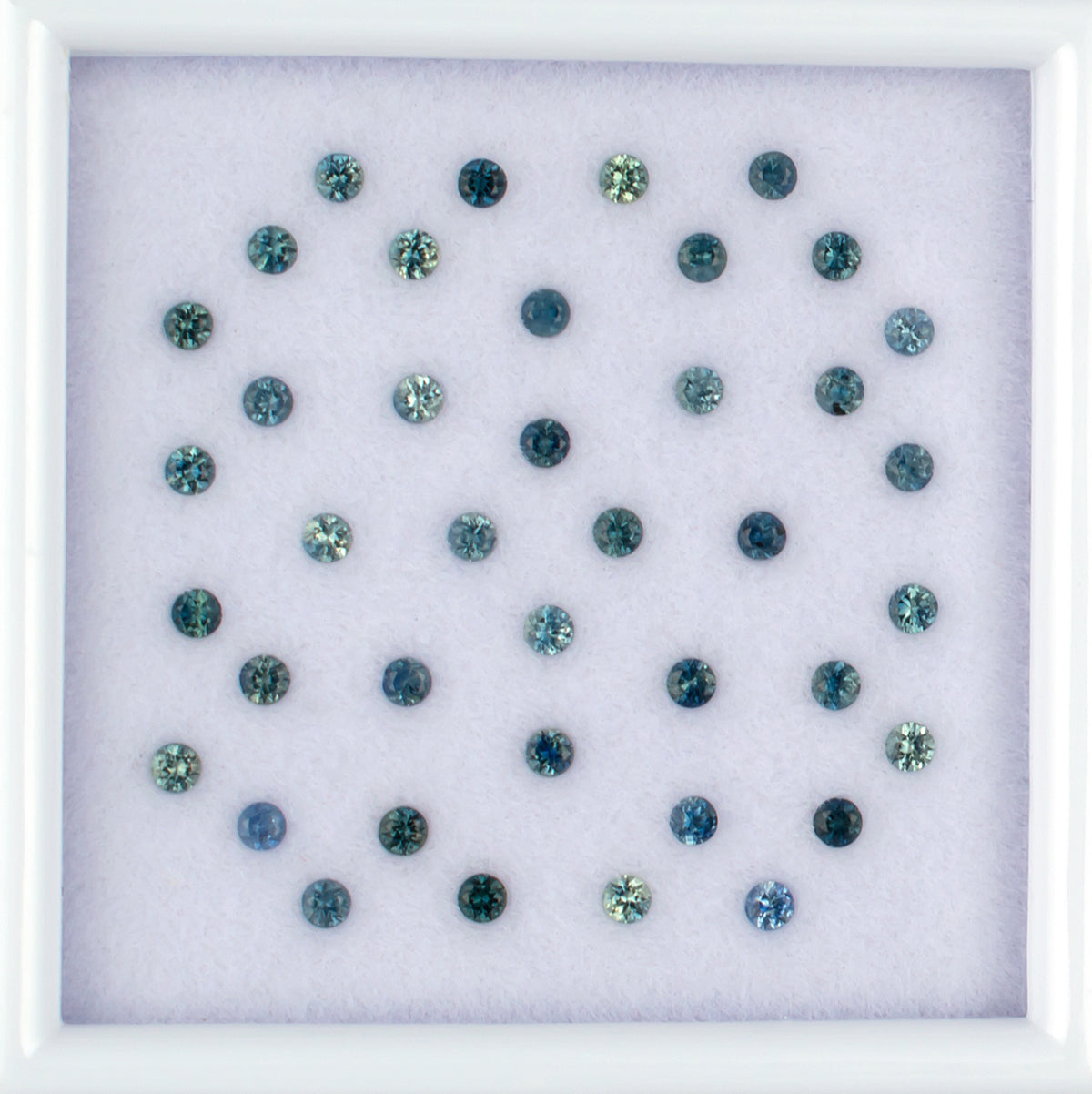 1.13twt Blue Sapphire Colored Gemstone Melee Parcel Top View White Background
