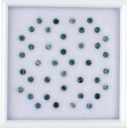 1.13twt Blue Sapphire Colored Gemstone Melee Parcel Top View White Background
