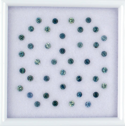 1.13twt Blue Sapphire Colored Gemstone Melee Parcel Top View White Background
