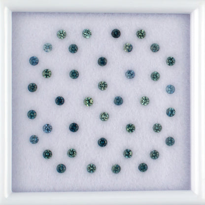 1.14twt Blue Sapphire Colored Gemstone Melee Parcel Top View White Background 

