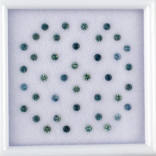 1.14twt Blue Sapphire Colored Gemstone Melee Parcel Top View White Background 
