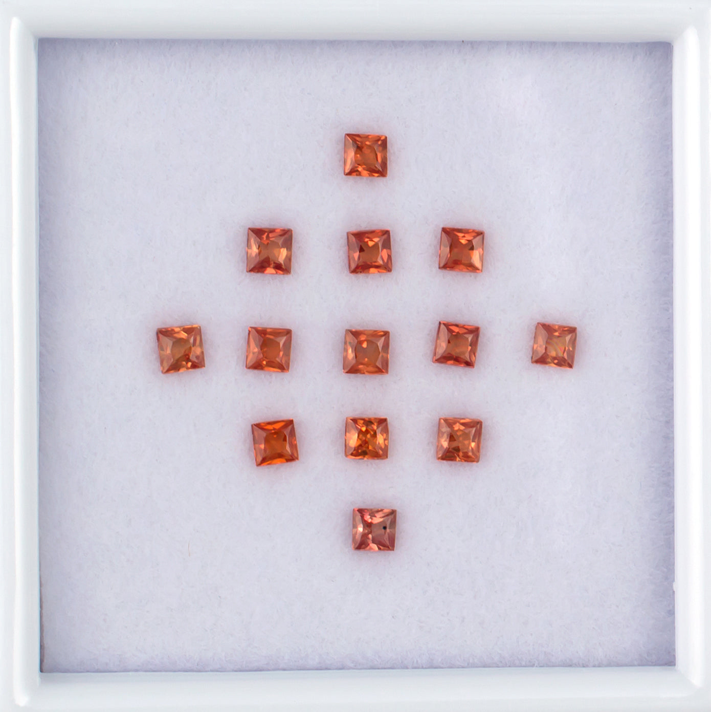 1.20twt Orange Sapphire Colored Gemstone Melee Parcel Top View White Background
