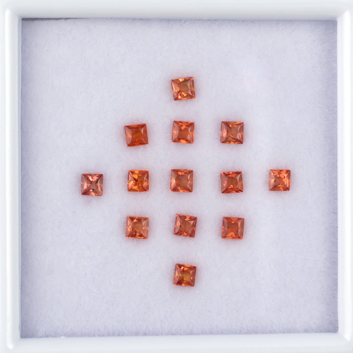 1.20twt Orange Sapphire Colored Gemstone Melee Parcel Top View White Background
