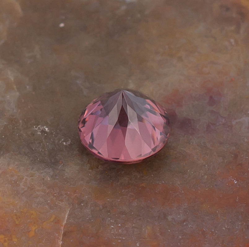 1.21ct Pink Zircon Colored Gemstone Bottom View Natural Background
