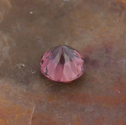 1.21ct Pink Zircon Colored Gemstone Bottom View Natural Background
