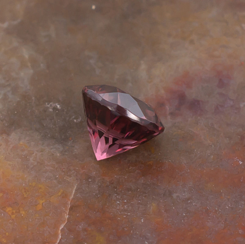 1.21ct Pink Zircon Colored Gemstone Side View Natural Background
