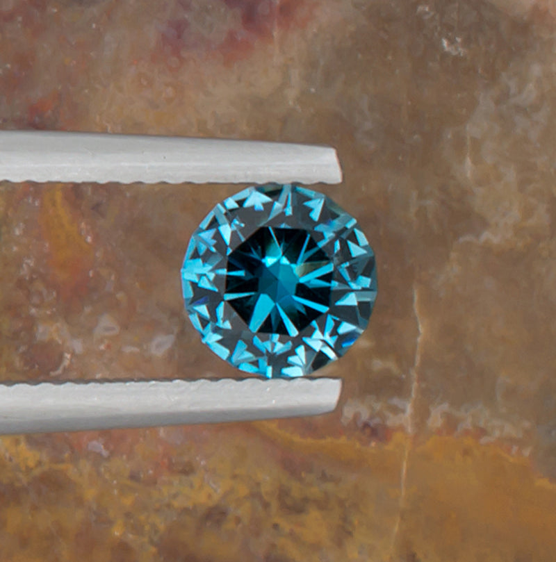 1.24ct Blue Topaz Colored Gemstone Top View II Natural Background 
