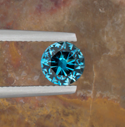 1.24ct Blue Topaz Colored Gemstone Top View II Natural Background 
