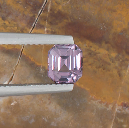 1.24ct Lavender Spinel Colored Gemstone Top View Natural Background 
