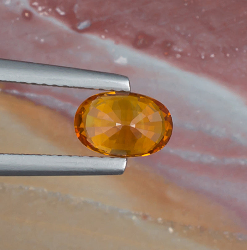 1.51ct Yellow Sapphire Colored Gemstone Bottom View Natural Background 
