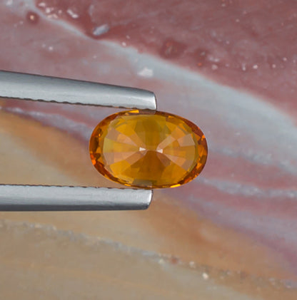 1.51ct Yellow Sapphire Colored Gemstone Bottom View Natural Background 
