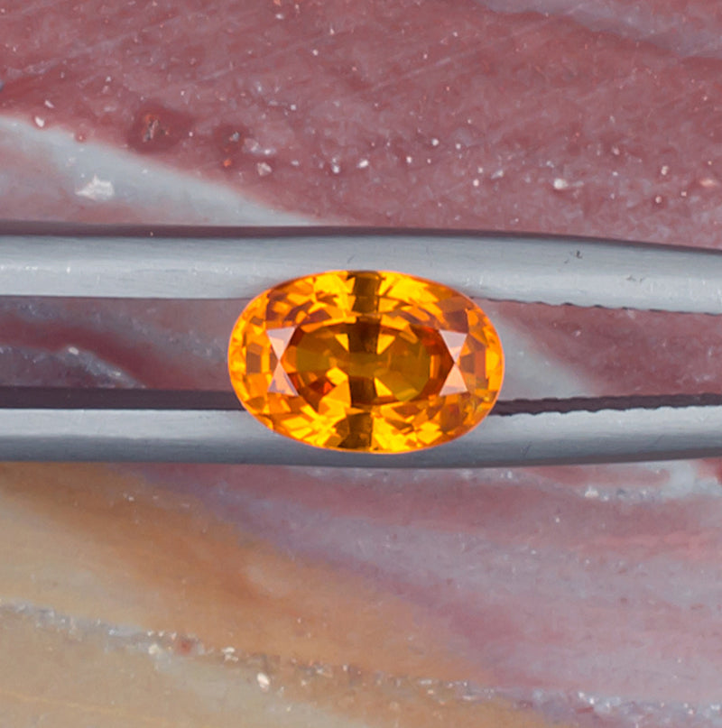 1.51ct Yellow Sapphire Colored Gemstone Top View Natural Background 
