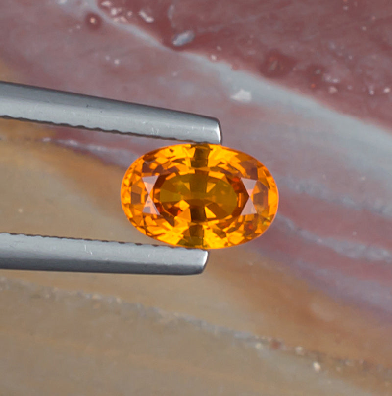 1.51ct Yellow Sapphire Colored Gemstone Top View Natural Background 
