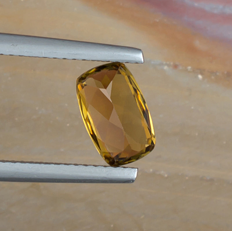 1.52ct Golden Tourmaline Colored Gemstone Bottom View Natural Background 
