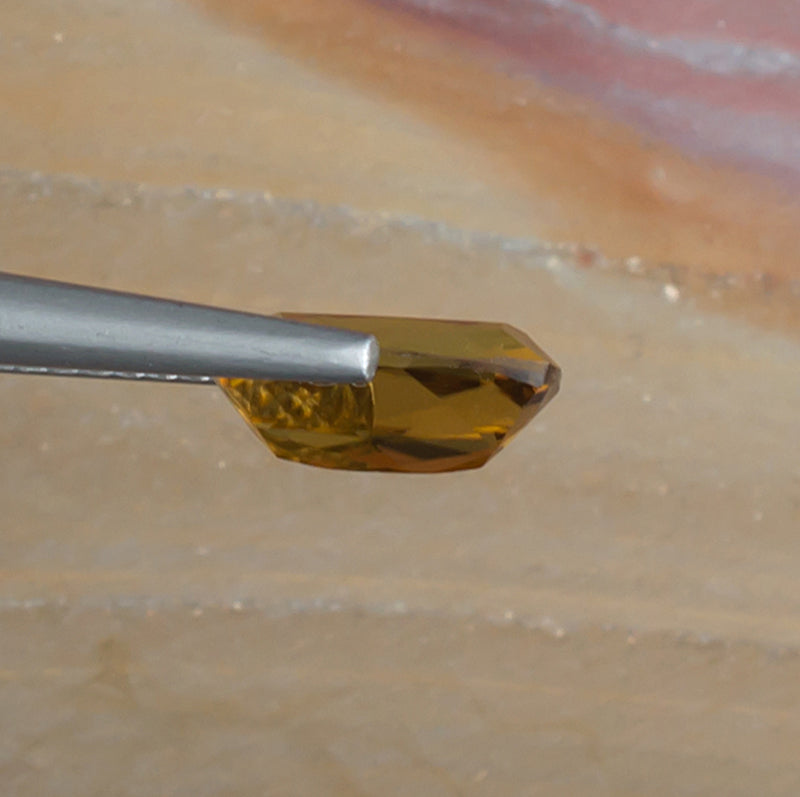1.52ct Golden Tourmaline Colored Gemstone Side View Natural Background 
