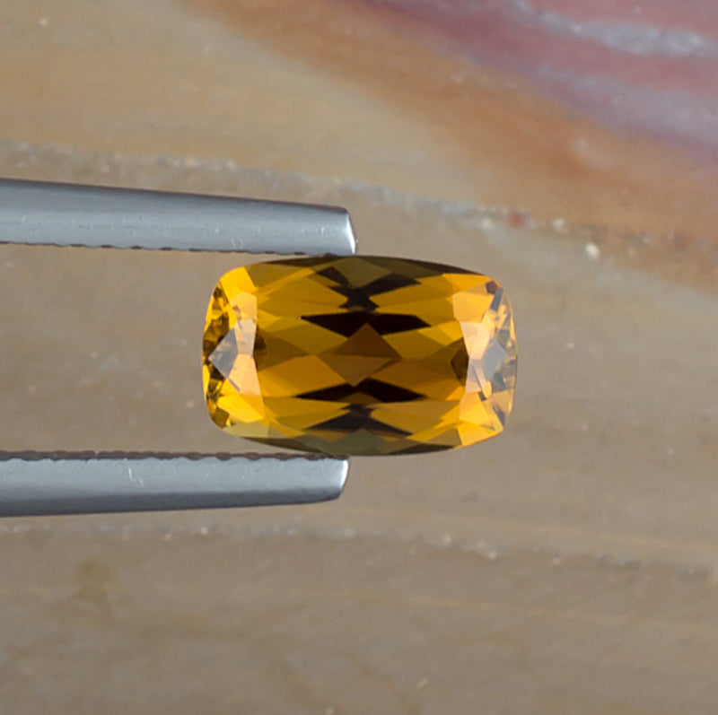 1.52ct Golden Tourmaline Colored Gemstone Top View Natural Background 
