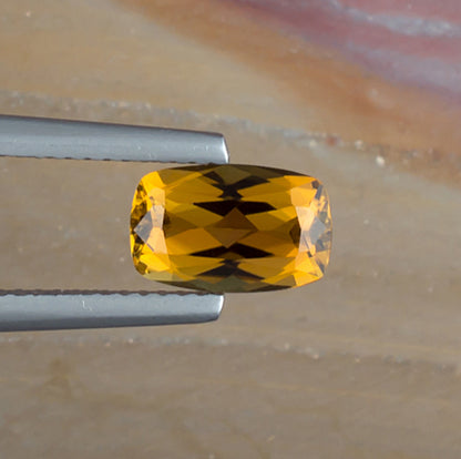 1.52ct Golden Tourmaline Colored Gemstone Top View Natural Background 
