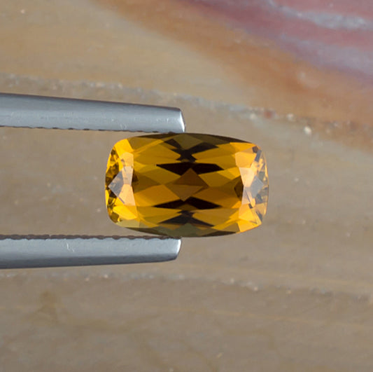 1.52ct Golden Tourmaline Colored Gemstone Top View Natural Background 
