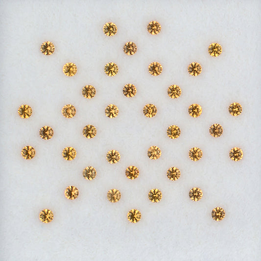 1.60mm Orange Sapphire Colored Gemstone Melee Parcel Top View White Background
