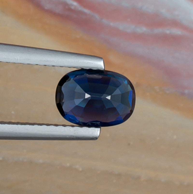 1.61ct Blue Sapphire Colored Gemstone Bottom View Natural Background 
