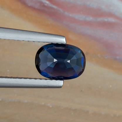 1.61ct Blue Sapphire Colored Gemstone Bottom View Natural Background 
