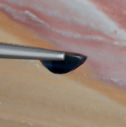 1.61ct Blue Sapphire Colored Gemstone Side View Natural Background 
