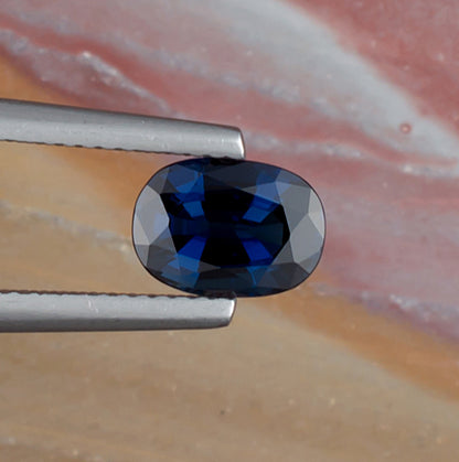 1.61ct Blue Sapphire Colored Gemstone Top View Natural Background 
