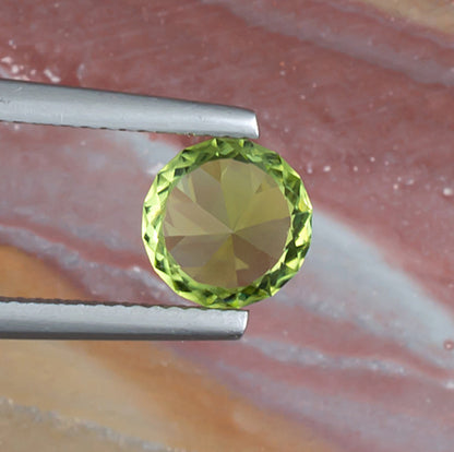 1.64ct Peridot Colored Gemstone Bottom View Natural Background 
