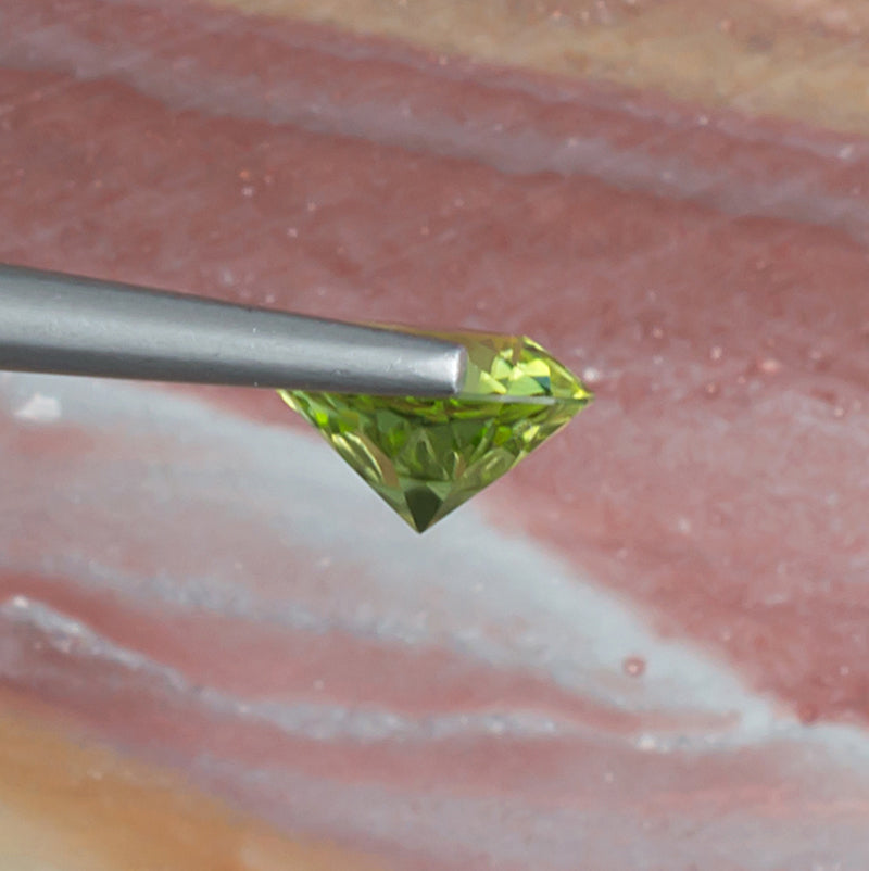 1.64ct Peridot Colored Gemstone Side View Natural Background 
