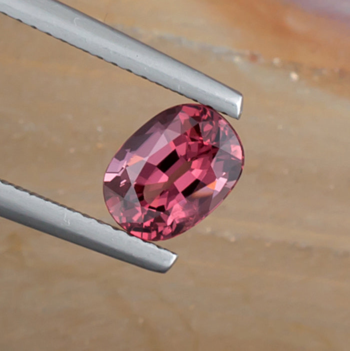 1.64ct Pink Spinel Colored Gemstone Top View Angle Natural Background 
