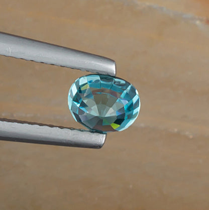 1.67ct Blue Zircon Colored Gemstone Bottom View Natural Background 
