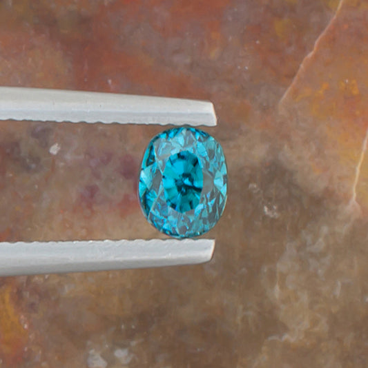 1.67ct Blue Zircon Colored Gemstone Top View II Natural Background
