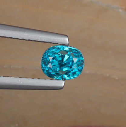 1.67ct Blue Zircon Colored Gemstone Top View Natural Background
