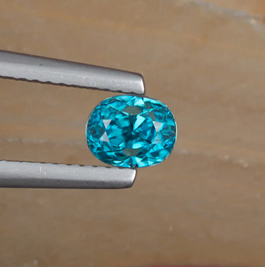 1.67ct Blue Zircon Colored Gemstone Top View Natural Background
